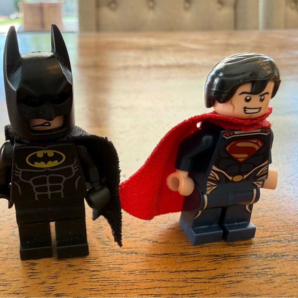 Lego Batman and Superman Minifigures with Black and Red Capes
